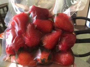 Strawberries infused with peach schnapps in the VacMaster VP215 vacuum chamber.