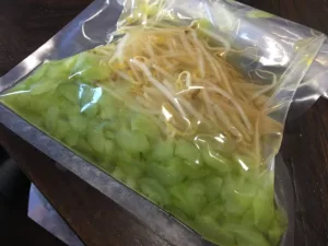 Cucumbers and bean sprouts rapidly pickled in the VacMaster VP215 vacuum chamber.