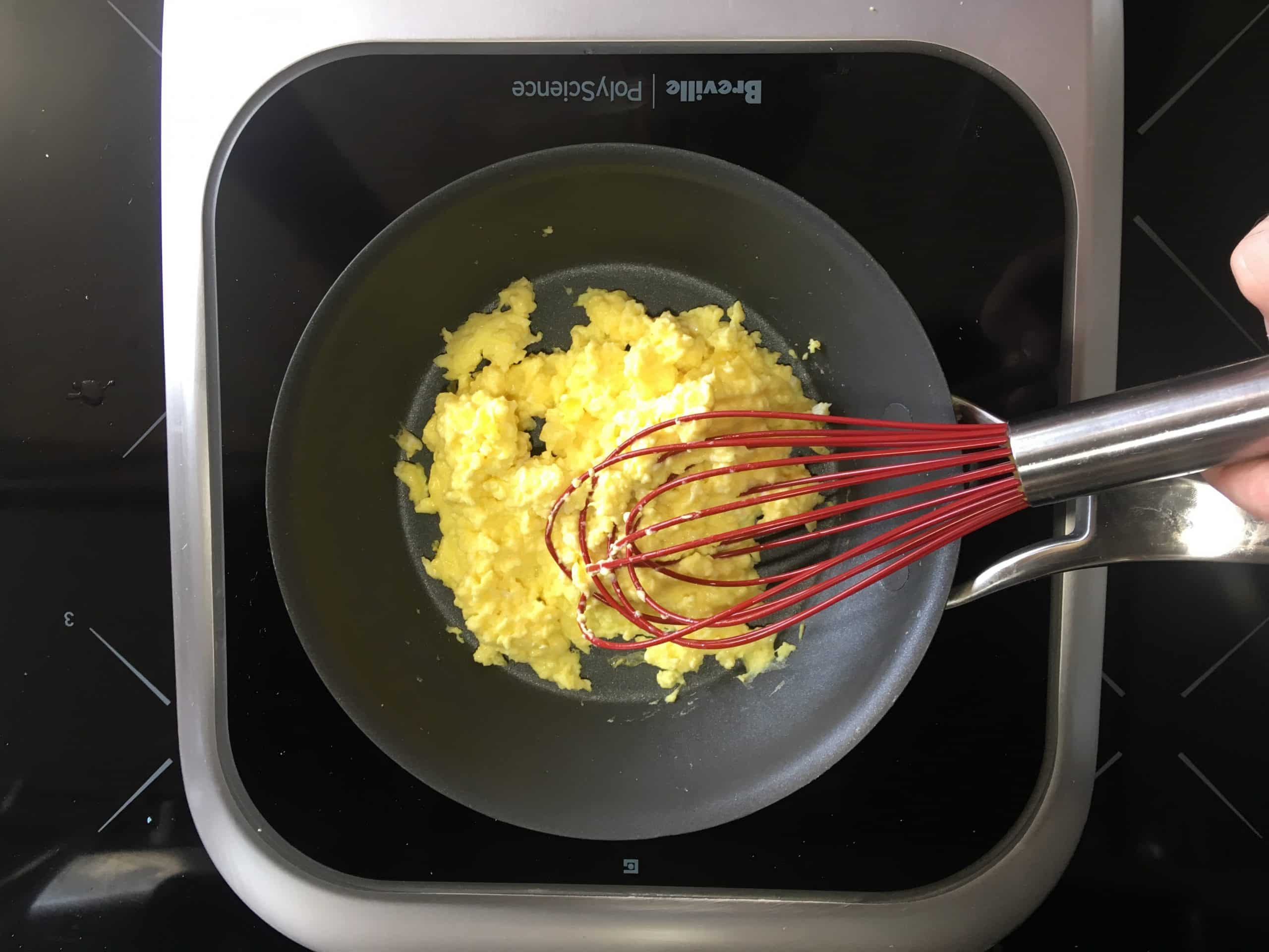 Protecting my nonstick pan by scrambling eggs with the Cuisipro 10-Inch Silicone Egg Whisk.