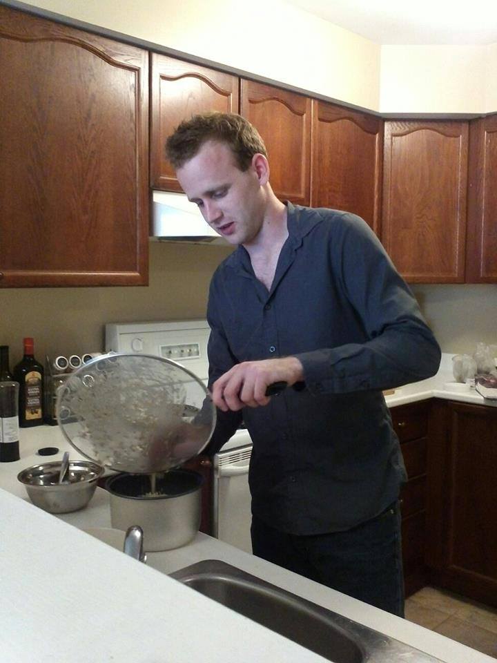 Straining rice in my first apartment. MacGyvering a strainer with a splash guard. I've since acquired a proper strainer.