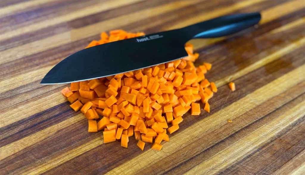 Dicing carrots with a Hast santoku.