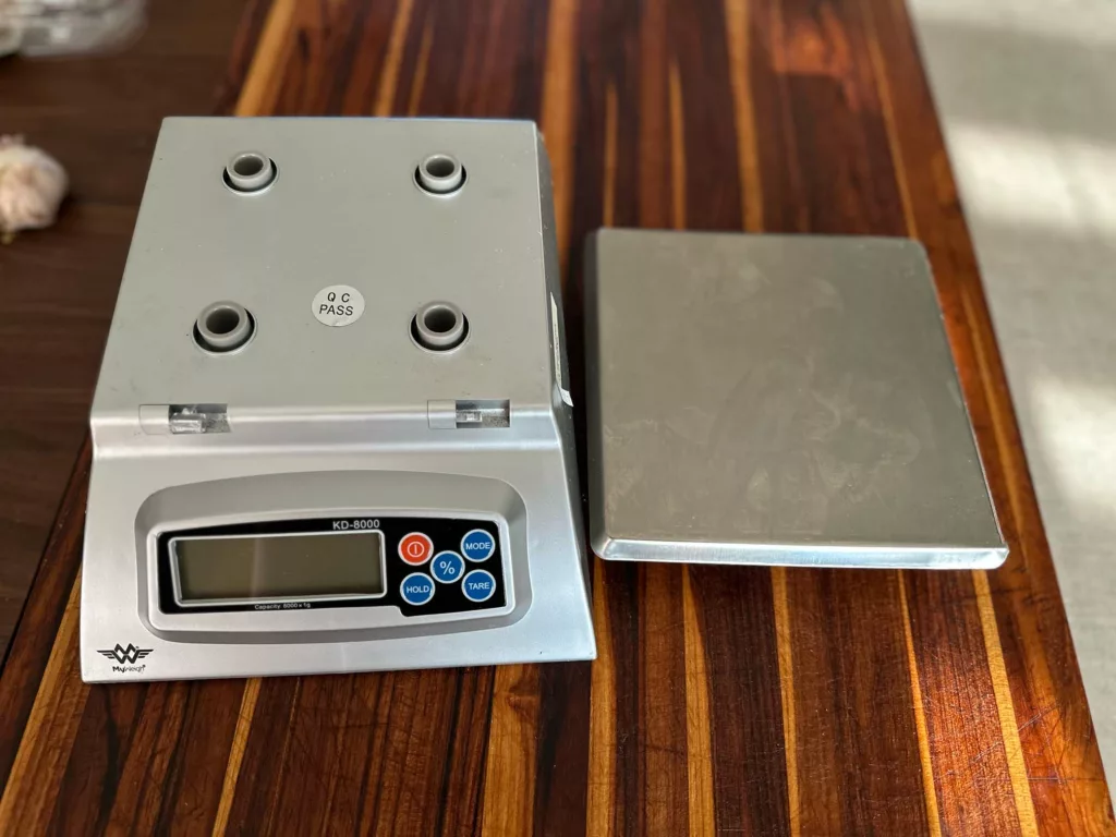 The My Weigh KD-8000 kitchen scale has a removable stainless steel platform for easy cleaning; one of the great features that make this the best kitchen scale for home cooks.